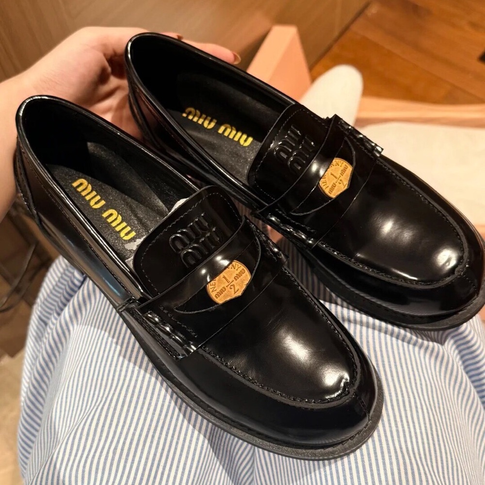 Miu Miu Black Loafers with Gold Accent